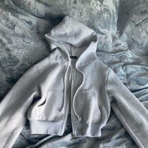 Crop grey hoodie with pockets and hood super soft and comfy wore once or twice.